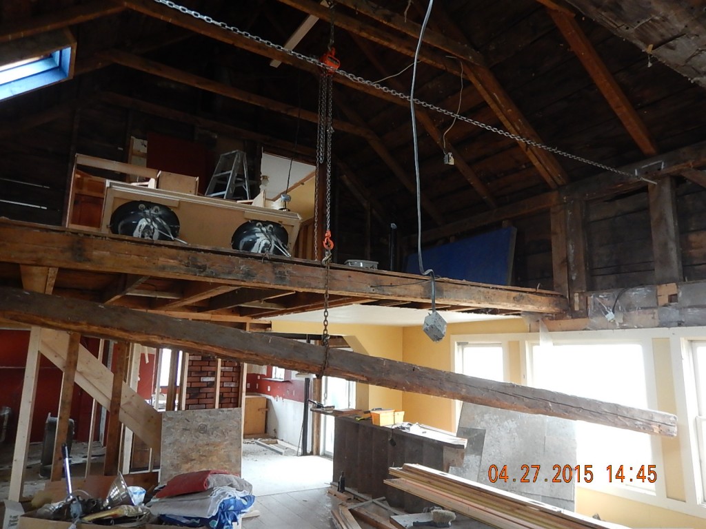 Lowering a loose beam. I was pulling insulation off of it when it lowered itself by 2"