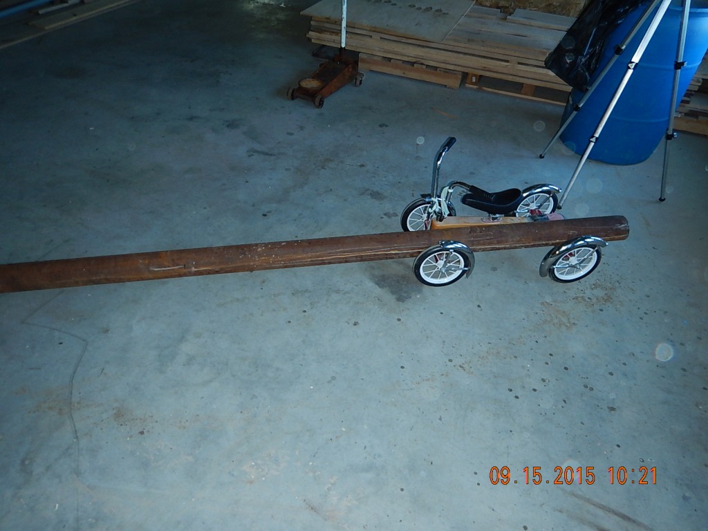 I didn't want to hurt myself lifting it, and the dolly was next door, but the kids' trike worked really well.