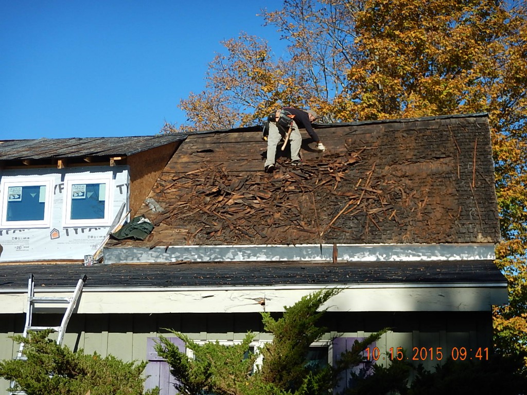 Step 1: remove metal roofing and old shingles.