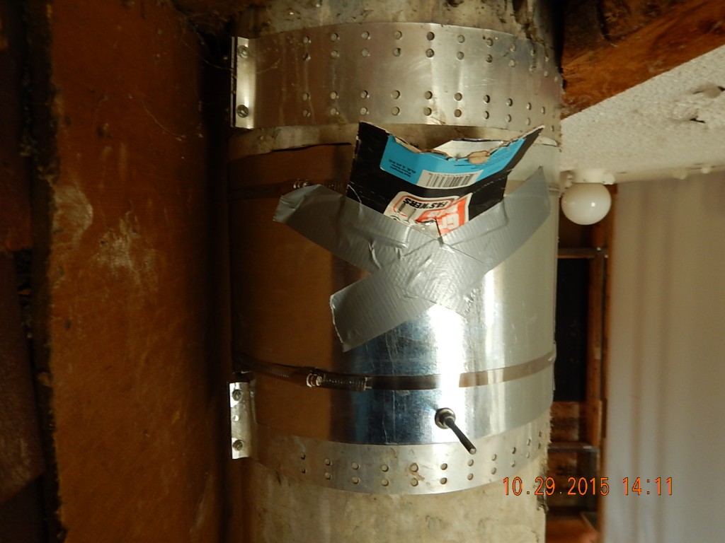 The flue had an 8" hole in it that had been open to the house for umpteen hears. Can you say carbon monoxide hazard? I sealed it with 24 ga steel inside and out, and poured cement into a hole in the jacket, using a cardboard funnel. It worked poorly, but it sort of worked.