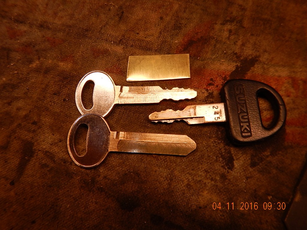 A 12 mil shim and another trip to the key grinding department at the hardware store, and I've got spare keys!
