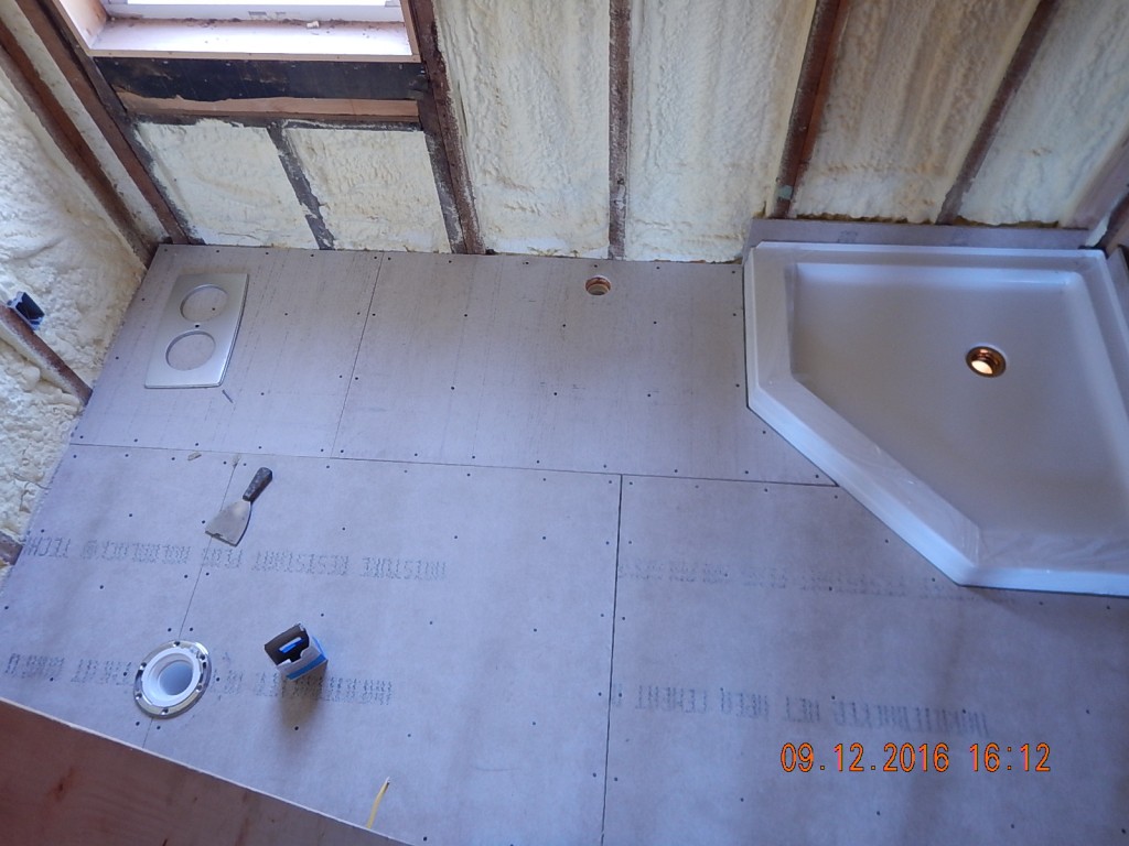 The bathroom floors were a hodge-podge of T&G, OSB, and holes. They are much improved.