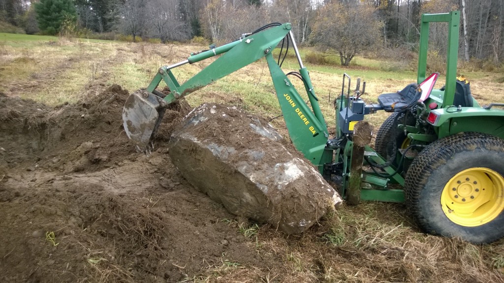 Remember the big rock that I couldn't get out of the ground?  I got it out of the ground.