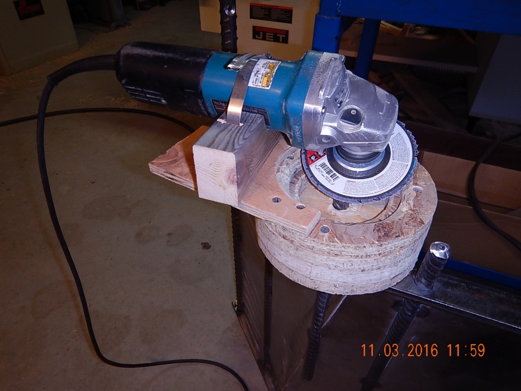 I cut off the sharpened re-bar on the range hood and needed a way to re-grind the ends to an attractive, uniform shape. So I made a grinding jig.