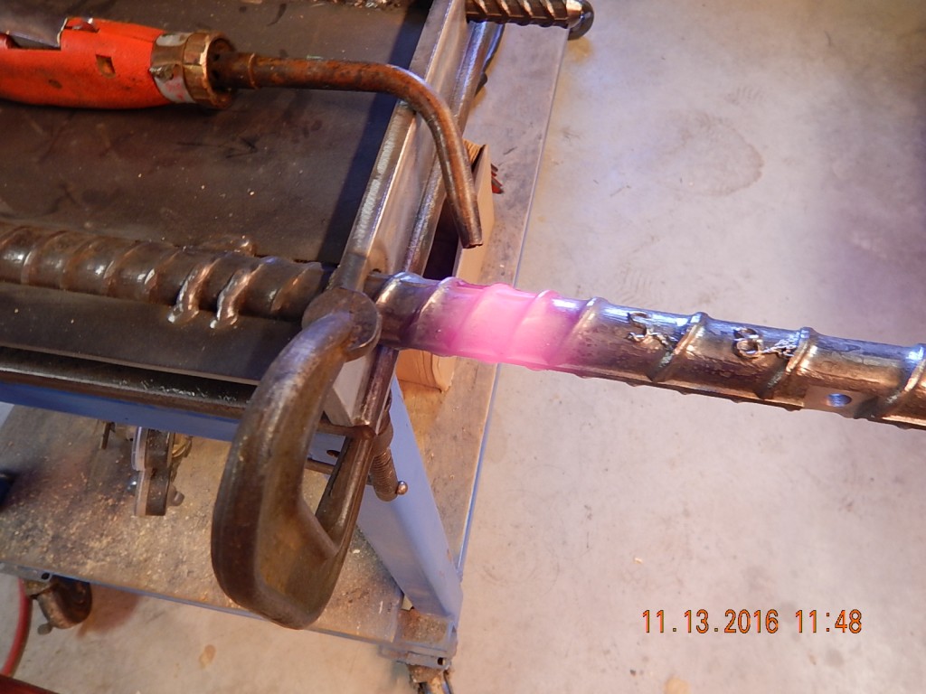 From my trial fitting, I knew that the right-hand rod was out-of kilter by about 2 degrees. It took me 2 torches, going full-blast to supply enough heat to bend the #9 re-bar a smidgen.