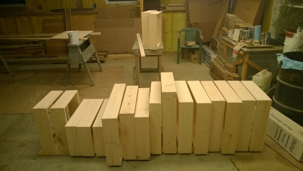 18 finger-jointed drawers, sanded and ready to go.  My nose is full of sawdust. So is everything else.