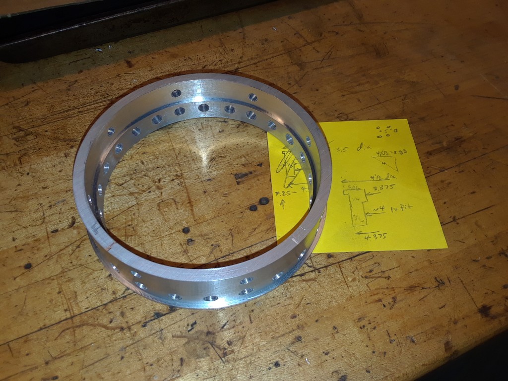 ... and ended up looking like this.  In between, there was a lot of careful re-clamping for a distortion-free thin shell.  Note the accompanying CAD drawing.
